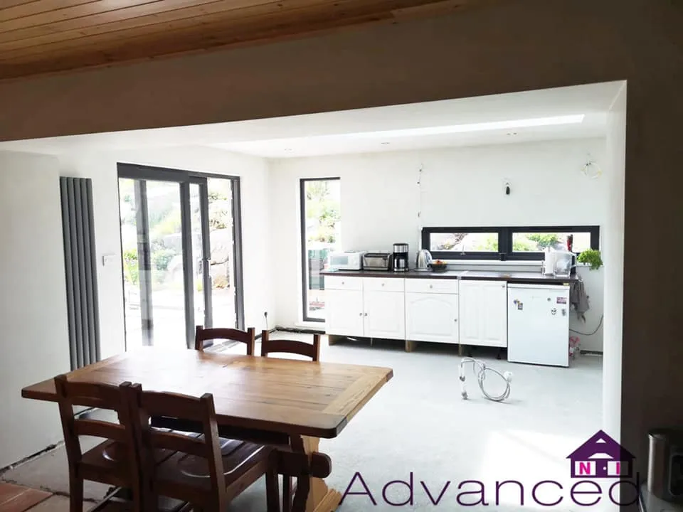 Bright open-plan sunroom kitchen and dining area