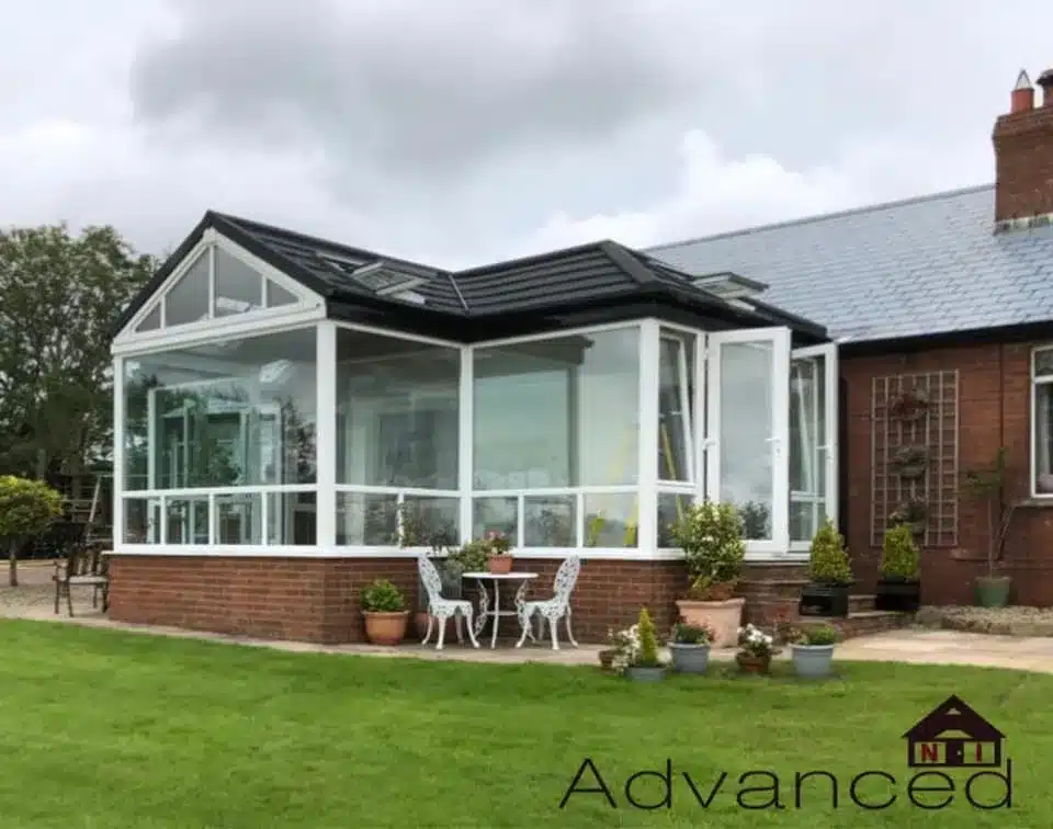 White conservatory with glazed roof before conversion