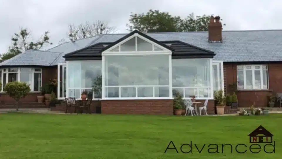 White conservatory with a new dark tiled roof