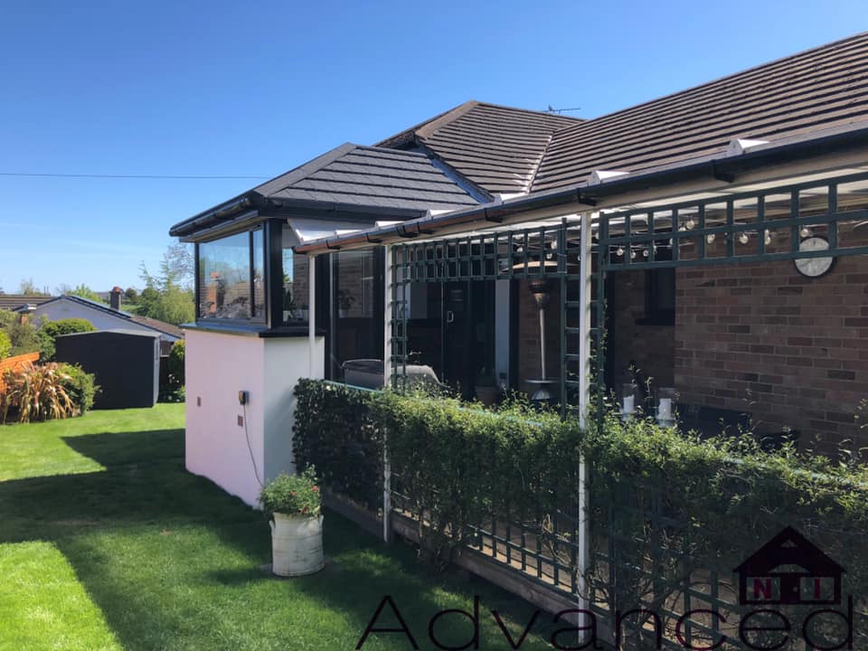 Sunroom exterior with black-framed glazing