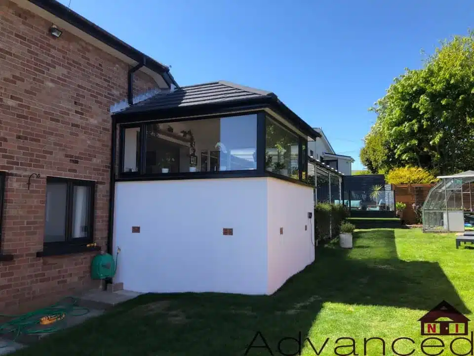 Rear sunroom extension with black-framed glazing