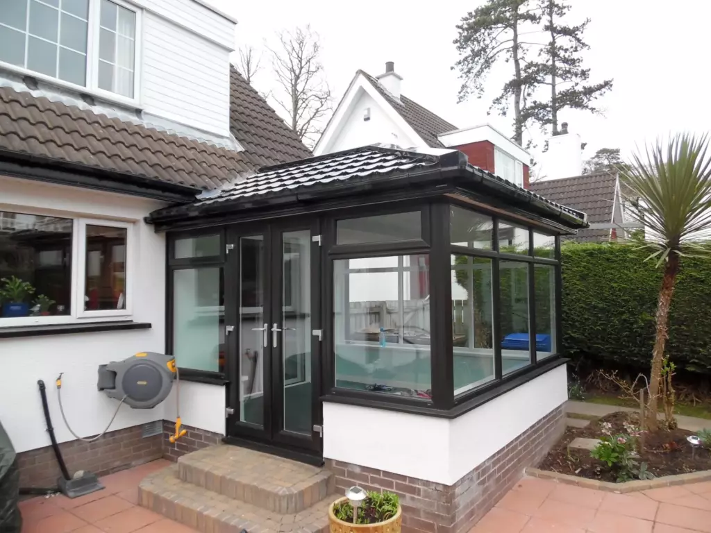 Grey conservatory after a solid tiled roof conversion