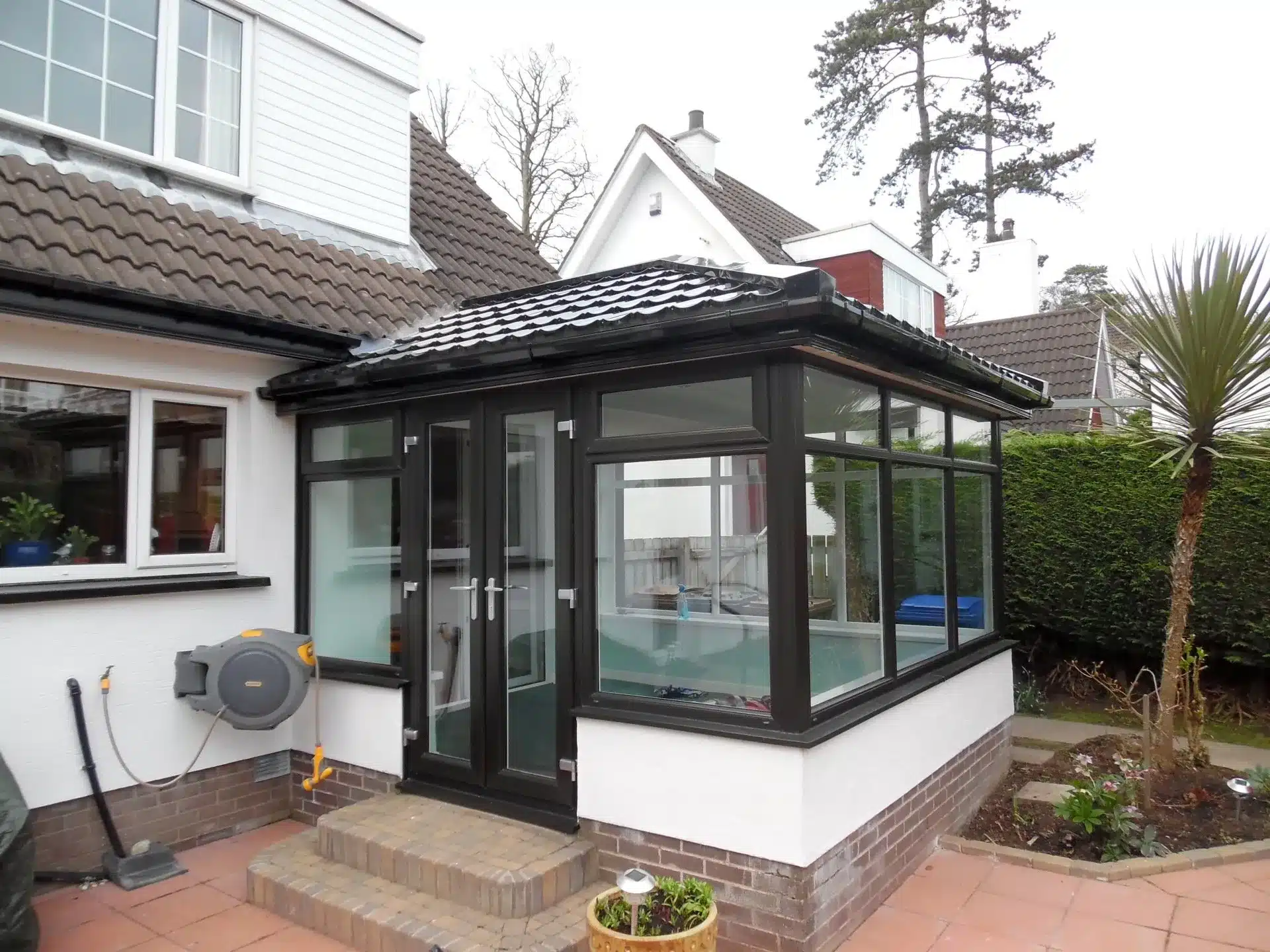 Grey conservatory after a solid tiled roof conversion