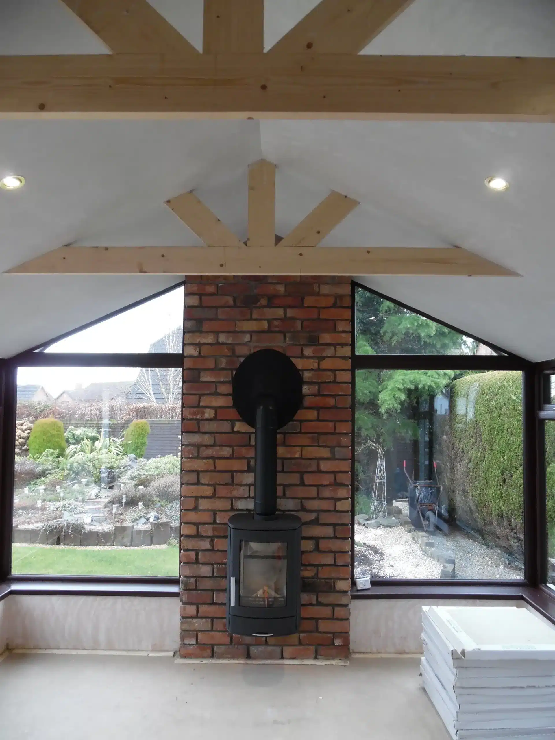 Sunroom interior with exposed timber roof beams