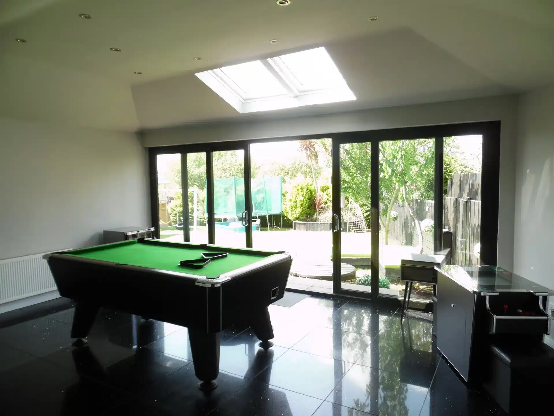 Games room inside a completed conservatory roof conversion