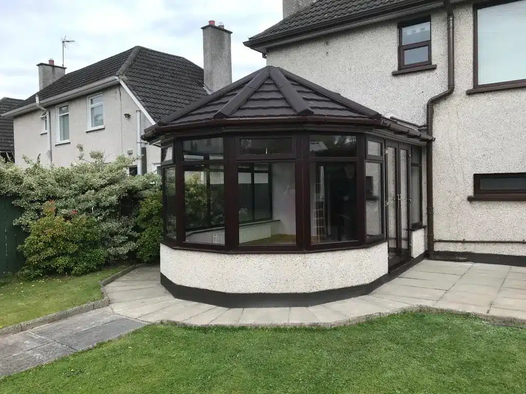 Conservatory with a brown tiled roof conversion in Ballymena
