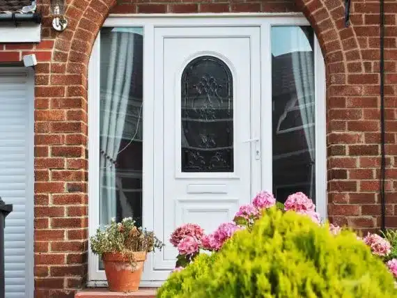 White PVCu front door with decorative glazing