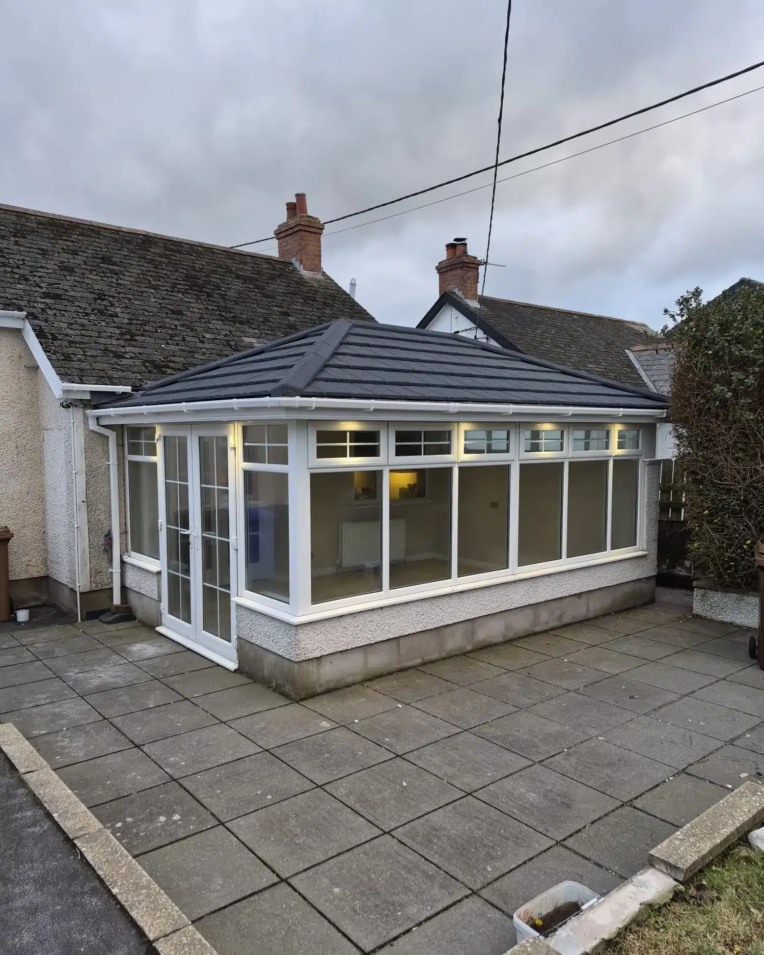 Exterior view of tiled conservatory roof conversion on a bungalow